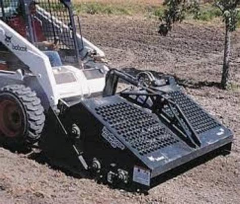 rent a skid steer and rockhound|rock rake for skid steer.